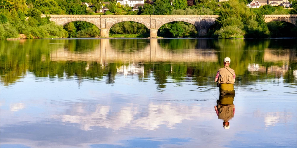Man fishing in the River Tweed