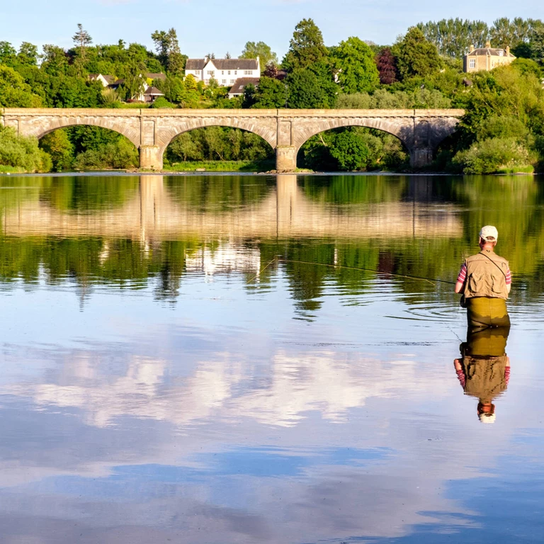 Man fishing in the River Tweed